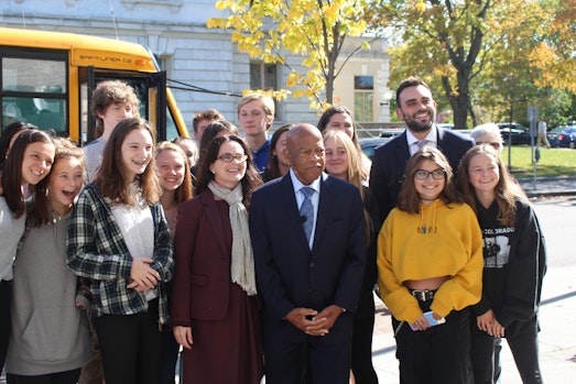 School kids with Representative John Lewis in front of the Flynn.